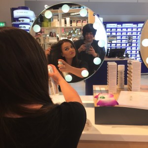 Nikki Taylor with a Selfridges Birmingham team member using OUAI Haircare