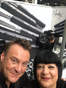 Nikki Taylor with makeup artist Paul Herrington on the Nanshy stand at IMATS
